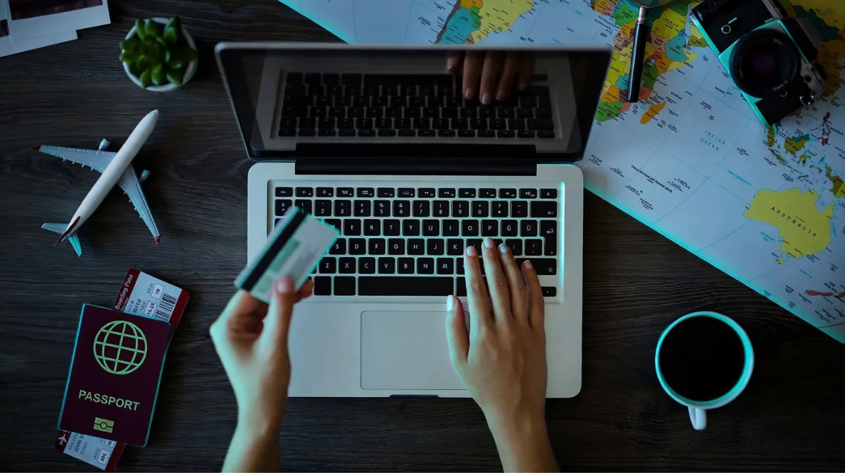 weirdwealth.io | Best Credit Cards for Travel: Top Picks for Every Trip Credit card and calculator beside a travel budget notebook.